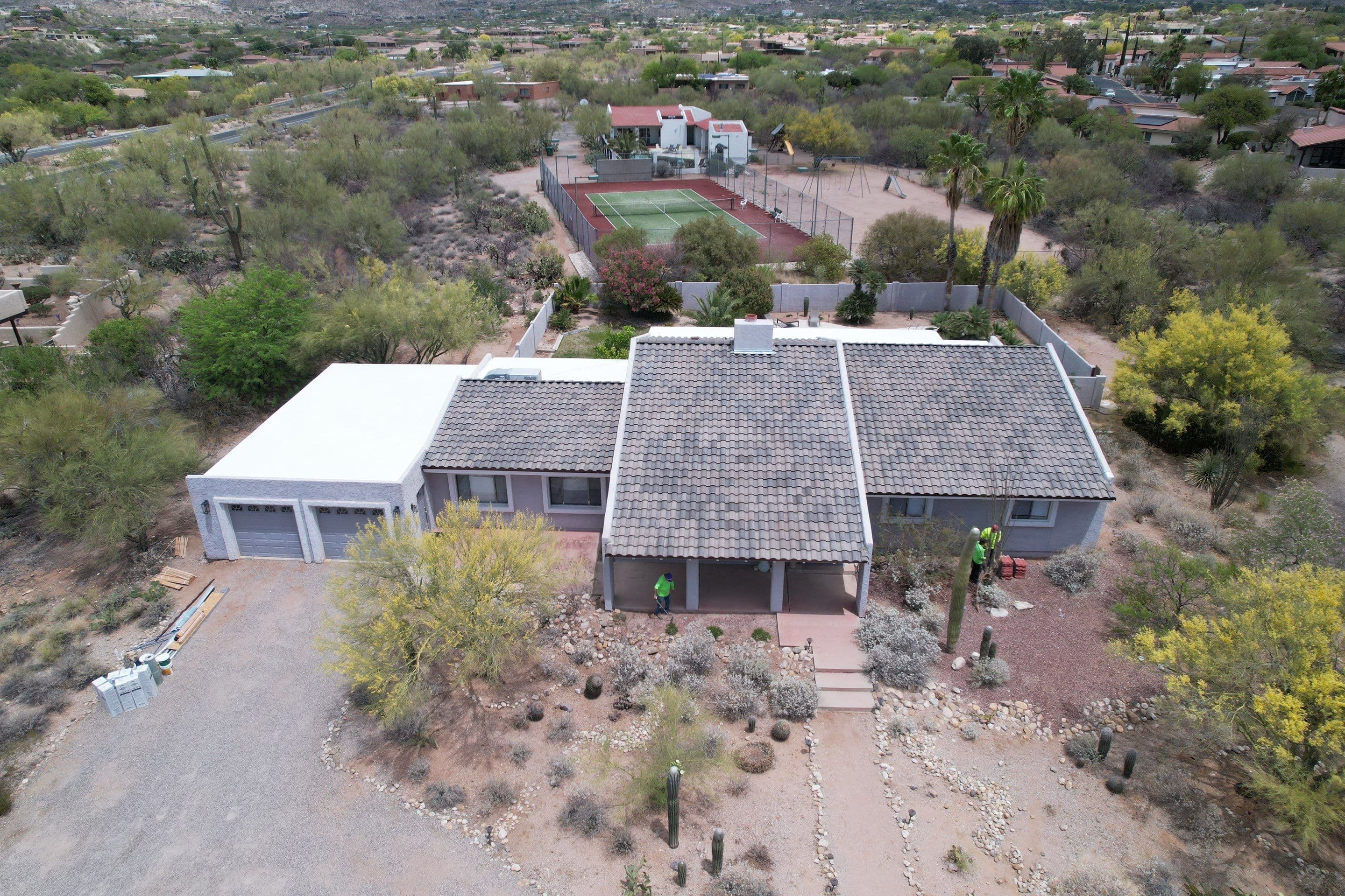 Aerial view of an estate roof with tennis court